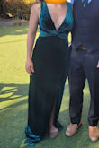 I am usually a solid Medium in items from Lulus, but this medium was quite generous. I ended up keeping it and wearing it my brother's wedding because I didn't have time to return and reorder (I was asked one month before the wedding to wear green), but would have liked to try on the small. The neckline was a deeper v than expected, and the cups were designed to accommodate much bigger boobs than mine. I successfully used my sticky Boomba inserts from my wedding to help fill in the cups and to help prevent a nip slip while walking/dancing. The dress was also quite long. I wore flats and should've had it hemmed, but with the slit, I was able to make it work. The material was quite stretchy and easy to move in. The cape in the back was a fun feature. I got a lot of compliments on the dress and felt like a princess wearing it. I will have it hemmed and take in the straps a bit so I can be more comfortable and a bit more modest and wear it to other formal events. (I kept catching people taking glances at my chest) - Tina D.