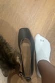 So I'm a size 7.5 in shoes. Since there are only whole sizes, I was advised to size up to an 8 by one of the consultants. It is no big deal because I was assured I could return it worst case. That is sadly what I have to do. These look so cute but they are way too big for me! I do not want any blisters so I gotta send them back. I tried them on so anyone else that's in between sizes can get a feel. Where my finger is is where my big toe is. Please excuse my cat - Christine N.