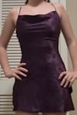 super cute! dress fits snuggly around the waist and flows out past the hips. Isn't very fitted in the back but that's just for my body type. I thought it could fit like a cowl neck but it doesn't really. - Emil F.