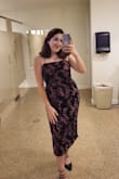 I attended a fall wedding, and this dress was fantastic for it! The lace-up back is beautiful, and it fits perfectly. The slit is a little higher than I expected but nothing super scandalous. I was nervous because there were no reviews to go off of. I fall between a M and L depending on the dress/item of clothing, but it's definitely true to size, especially since it has stretch. If you're on the fence like me, I'm going to suggest that you don't size up like you have to with some other dresses on here. - Anna K.