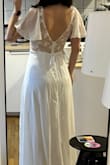 I loved this dress on the site, looks so elegant! But on me, it looks a little strange; the waistline is a little tight for me (if you have a wider ribcage, this might be your issue too), and it's definitely too long so I have to have it hemmed. Since it is mostly polyester, it needs a good ironing and might be a little hot for a summer wedding. It looks a little plain from the front so I added a belt. Overall good, but I'm not sure if this will be the dress for my wedding. - Lilla S.