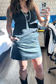 I bought this for a concert and it looked great!  The skirt fits great and is a perfect length! Only disappointing feature is the inside lining of the skirt is basically made of tissue paper so it ripped in multiple spots to include the pockets. The fake leather held together fine, but the pockets are no longer usable due to the poor lining. - Morgan S.