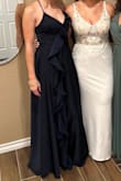 I wore this dress as a guest at a wedding, and I loved it! It fits true to size, but it is very long, so you will need to wear it with heels. I felt very confident wearing it, and I received so many compliments on it! - Paola E.