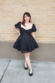 Wore this dress to a goth/all black formal wedding and received a ton of compliments! The dress felt a little risky at first, but it actually poofs out into a perfect length.I was also able to wear without a bra and have good support. The bust of the dress is well fitting cups. I have larger hips and thighs, so the way the dress flows out worked very well. The material is somehow stretchy and I was comfortable even after a big dinner. Taking one star off because the material is extremely high maintenance and hard to iron. Dress arrived extremely wrinkled and it took a while to smooth it out while still delicately ironing. But otherwise, I loved this dress! - Miriam B.