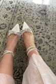These shoes are so adorable. I bought them for my engagement photo shoot. They are definitely not the most comfortable, but I'm not a pro with heels. I bought an 8.5; they are true to size. - Mercedes C.