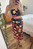 I love the pattern and that the skirt has the mesh overlay. The quality is kind of cheap looking in my opinion but still cute and looks great with heels. The skirt was very tight to get into, but I think a bigger size would have been too loose in other areas. The flowers are more tropical looking than I'd realized from the website pics so I will probably only wear it in a tropical location, but I love that it's a 2 piece and it looks classy so still glad I got it. - Nicole D.