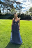 I got this dress shipped overseas, so when I received it, it was so crushed! I was fortunately about to get it steamed, and it came out so lovely even with the material being a bit more stiff. It fit perfectly! Although a bit longer than I anticipated, it just made me feel like a princess in my ballgown. The colour in the sun sparkled, and I received so many compliments about the dress all during the night. Definitely a 10/10 from me! - Ruby C.