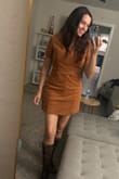 I absolutely adore this dress! I ordered my usual size and it fit perfectly. The material feels nice and isn't stiff. Great for fall with boots. - Jamie S.