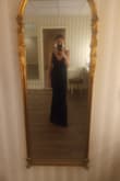 I loved this dress! The material was great. I did have to steam it to get the wrinkles out. Otherwise, it fits true to size, and with heels, I didn't need it hemmed! - Jennifer L.