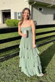 The color was perfect for the outdoor wedding; it was tight around the top and long enough for me to wear heels! I loved the ruffle on the bottom! - Jourdan B.