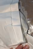 Dots of stains right at front. Runs small, whereas another dress I ordered at the same size was perfect. Quality of the fabric and stitching doesn't feel great. Just doesn't quite look like the picture. - Neta S.
