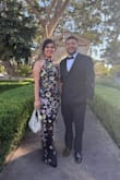 The material does not stretch, length is perfect if you are going for the long gown look. (Note: I was wearing 4 inch heels) The slit in lower back is perfect. It was a little loose in the chest area. Overall it was a perfect fit!! - Evelyn E.