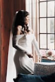 Love how simple it was. I did add some button in the back and cut the front a little shorter. You can make this dress your own by adding small details. Overall I'm glad I bought this dress for my wedding. - Gabriela V.