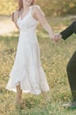 I bought this dress because I wanted one dress that I could wear to my engagement photos, bridal shower, and rehearsal dinner and this dress is absolutely it! The fabric is beautiful and textured, the cut is feminine and flattering, and the bows on the shoulders are a cute touch. - Catherine B.