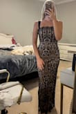 I absolutely love this dress! The lining is super soft and overall very comfortable/flattering. I'm 5'9 and finding a dress that's actually floor length is so hard to find, but the length is perfect for me. The top (front part only) is a little big and I might try to take it in some, but overall it fits great. If you're in between sizes or smaller chested, I'd definitely size down. Bonus points for having adjustable straps though:) - Emily T.