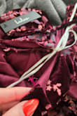 Color is very plum; the dress and tiers are pretty, but the strap literally snapped at the seam when hanging the dress up. Even tho this is a fault on Lulus, the only option is to return and they charge me 2 dollars to restock? - Sam C.