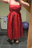 Fits large?! Try fits huge! It is so ridiculously poufy I could have made a blanket out of it. Way too much fabric, it made me look so heavy. The color is not the beautiful red in the photo, and the pleats are all messy. Save yourself, don't risk it, and DO NOT buy this dress. Not happy with the return policy (none), and your sizing is a mess... bought another medium dress and it was way too tight. - Katharine M.