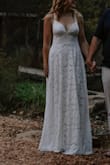 I ordered 4 dresses from Lulus for our anniversary photos, and this was the winner! The lace is sturdy, and the dress is completely lined. It has a good weight and is well made. It was long on my 5'6 frame, even with tall heels. If I was wearing it for anything more than photos, I'd have to get it hemmed. This dress is very flattering on my pear-shaped body with the A-line skirt. I used sticky padded inserts on the top since I'm a B cup (it is very low-cut front and back, so you can't wear a strapless bra). I'd say if you're bigger than a C cup, go up a size for coverage. If you're looking for something simple and elegant, I would recommend this dress for sure! - Ashleigh S.