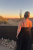 Okay, so I loved this dress right when I saw it and knew it would be great for a formal wedding I was officiating. The dress arrived on time, but oh my goddddddddd, it was SO WRINKLY. Like BEYOND. I had to steam it 4 times, and every time I did, it stretched because I had to pull on the tulle to get it taut enough to get the wrinkles out. So it ended up being about 3 inches longer than it was supposed to be. The middle is also completely sheer with black boning, and that's not shown in the photos. I liked it, but if you're wanting something more conservative, that might hinder you from this dress. The slit is perfect and adds a little flare. I loved this dress and it fit like a dream. I got compliments all night, but my god, the work it took to get it in a presentable condition almost made me not want to wear it. Don't buy it if you don't have a steamer and 4 hours. I'm 5'5, size 14 and bought an XL. I wore 5 inch heels and it was just long enough for that. - Hannah T.