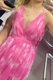 Stunning dress! A little too long for me even wearing heels, but I am a little short. Straps were able to be adjusted to keep the bust in place and otherwise a great fit. Bright pink! - Jordan H.