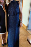 I usually wear a medium, had to order a large as it was snug around my hips. Very pretty dress for a formal wedding. - Jeanne H.