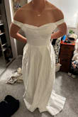 Dress was good quality and I liked the material, but it was very big on me. I was right on the small/medium mark for measurements. I decided to go up and get a M, but I should have gotten a S. My advice would be to size down if you are looking for a wedding dress. - Kayla M.