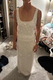 This dress was beautiful and had potential but I ordered too big of a size. I usually buy M or L in Lulus other dresses and was on the S/M cusp on measurements, so I decided to size up. I would recommend to size down. It is a little long for me also. I also have a smaller chest and the neckline was not flattering on me. - Kayla M.