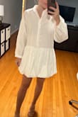 It's a very wide/oversized look, I would size down. It is slightly see-through on the top too. Still cute though, I'll be wearing it for my bridal shower! - Kirsten H.