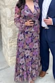 Wore this dress as a wedding guest and couldn't be happier with the fit. The cut at cleavage isn't too low and the wrap-around string was secure and held well all night with my 36C cups. The dress was flown and gave a subtle slit that you can show off in pics if preferred. Great dress for sitting and dancing as it doesn't pull in any areas and rests nicely on waist and hips. The overlay material was colorful and the print material was high quality. They made the liner a solid shade of purple, and it was so cozy inside and didn't irritate my skin at all. Would highly recommend this dress! - Hanna S.