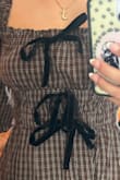 Love the dress, but the bows are off center on mine. I'm not sure if this is just a mistake on my dress, or if it is like this in them all, but the advertised picture shows them centered. Sad because I was really excited about the dress :( - Hallie M.