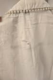 This shirt is very flattering and perfect for work. However, when I received it, it was extremely wrinkled. The care instructions advised to iron on low which I did. Do NOT iron this shirt, I barely touched it with an iron and it immediately fried the shirt, see photo. I would have never tried to iron it had the care instructions not advised it would be okay to do so. - Jordann T.
