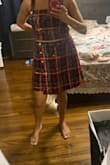 It's so pretty and shiny. It's perfect for Christmas. I see a little peek of the tummy, but it looks cute. So I think you can definitely wear it as is or with a top underneath. I got the skirt to match, so beautiful! Lovely combination for Christmas! - Vishma M.
