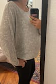 I am 5'10" and usually 185lbs, right now closer to 210lbs. This sweater fits very comfortably and it's flattering even with a baby bump. It will fit nicely, oversized but cute slouchy, when I'm back to my normal size. It's not as dressy as other Lulu's sweaters but is still work appropriate for an office setting. It looks great with jeans, shorts, or over gym clothes, but I do feel slightly under dressed wearing this to work. For me I think it's the way the arms/armpit area hangs. It's cute and comfortable but slightly too casual for my office. VERY comfortable, can recommend if you are building a capsule wardrobe. I reach for this often on the weekends. Great for any season, but does not offer much warmth. - Kristen