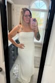 The dress is a little long on me but I expected that. It fits so well everywhere else! It will be perfect for our elopement! - Kathryn W.