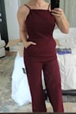Material is good quality, and the jumpsuit fits comfortably. Super flattering with the open back. - Michelle B.