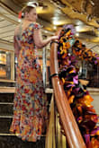 It fits just as expected and is very flattering. I love the unique sleeve design and it turned a lot of heads. The colors are very fun and I'm glad I got it! I wore it on our cruise and will wear it again! - Olivia O.