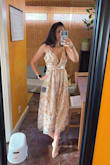 Very original dress. You would have to wear sticky bras though. At least with my bust size. I will wear this for my son's baptism. - Carolina B.
