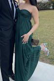 When I tried the dress on, I was worried it would wash away my curves but it ended looking great! The material is silky and a beautiful dark green color. It was a bit long for me even with 2" heels but manageable since I had no time to tailor it. I thought it would be a good idea to use fashion tape to pull the top part up more, but the tape I used didn't really work and just leaving it as is worked for me (keep in mind I have B cups). But overall loved it!! This dress got a billion compliments! - Stephanie E.