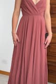 The dress is beautiful. I'm a small size and it was too long for me. It's also a little big in the bust area. I still like the style and the shape. The fabric looks good quality and has several layers. - Victoria L.