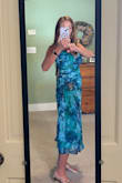 I ordered my usual size XS, and I was disappointed to see that I could not even zip the dress as it was super tight in the ribcage. Luckily, I was able to exchange it for a size S, which fit much better. I love that it has adjustable strap, and the ruched midsection hides any belly bloat. I look forward to wearing this to a wedding in Florida in January. - Heather F.