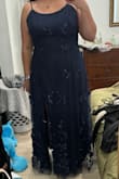 Super cute dress, good material, it ran a tiny bit big like barely so it was really comfy to be in. The slit goes a little high so I just got that tailored. - Michelle N.