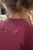 I typically wear small but had to size down to XS. The small was too baggy in the armpits and was bunching in the back. Even the XS I felt like slightly stretched out as I wore it through an event. It was very warm and cute but other complaint is where the tag is placed causes weird indents on the back! - Madison S.