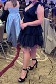 The dress is beautiful - balance of classy and sexy. The outer material is tulle, but it's lined, so it's not itchy on your skin. The details of the dress add to the character, perfect length for a petite girl like me. - Angeli P.