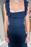 Dress is nice and well made. It fits in the waist and hips well (used the Fit Me to determine size and usually order a small but it said XS and so glad I did). However, the dress hung too loose on the chest and it hung definitely lower on me than the pictured model. So l have to pull it up and tailor the sleeves and chest to get it to hang right and look like the model. So I'll try to fix it since there isn't a smaller size and ordering another one would have the same problem. - Tasha S.