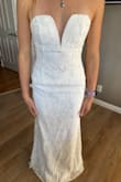 You really need something to pull this dress off. It made me look as flat as a board. The fabric in the front also came up around the midsection and it was hard to pull back down. - Kenzie M.