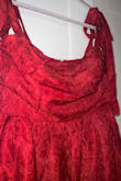 This dress is gorgeous in person! It's super soft and I love that it has some stretch. The dress adjusts to my waist and shoulders perfectly. Highly highly recommend this dress! - Saphira C.