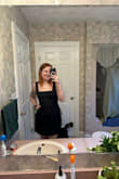 The dress is a tad bit shorter than I was hoping for, but it fits really well otherwise! The bow in the back makes it easy to adjust accordingly so it fits even for someone with a smaller chest like me. The material felt like a super great quality! - Kerigan B.