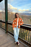 I got this cardigan while on sale to wear for Thanksgiving. It was perfect! Super soft and looks exactly like the picture with a fun puffy sleeve. Beautiful burnt orange color with flowers. High quality and great for the fall time. - Ali S.