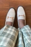 I looooove these shoes!! It's a good mix between a ballet flat and loafer. I bought my regular size and they fit good, they're snug so no concerns with them falling off. I'm still able to put a light pair of socks with them. If you're looking to wear with thicker socks, you should size up. I'm currently wearing them with Lulus Modish Behavior Cream and Green Plaid Corduroy High-Rise Pants. It's a perfect paring option with a white sweater. The white shoe is also so beautiful, goes with everything and is more unique. - Carolyn C.