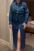 The dress runs big on the top but felt tight on the bottom. Ended up returning cause it did not flatter my body type at all - Ashley N.
